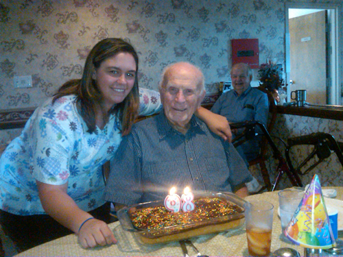 caregiver and her patient having a birthday party