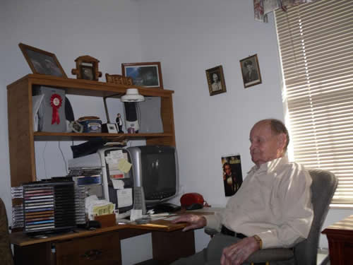 old man sitting on gray chair