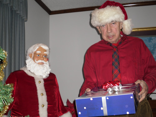 old man carrying a gift