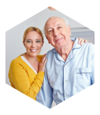 caregiver and senior man smiling