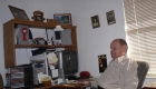 old man sitting on gray chair