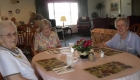 three elderly women sitting in one table