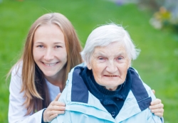 portrait of an elderly woman and her caregiver